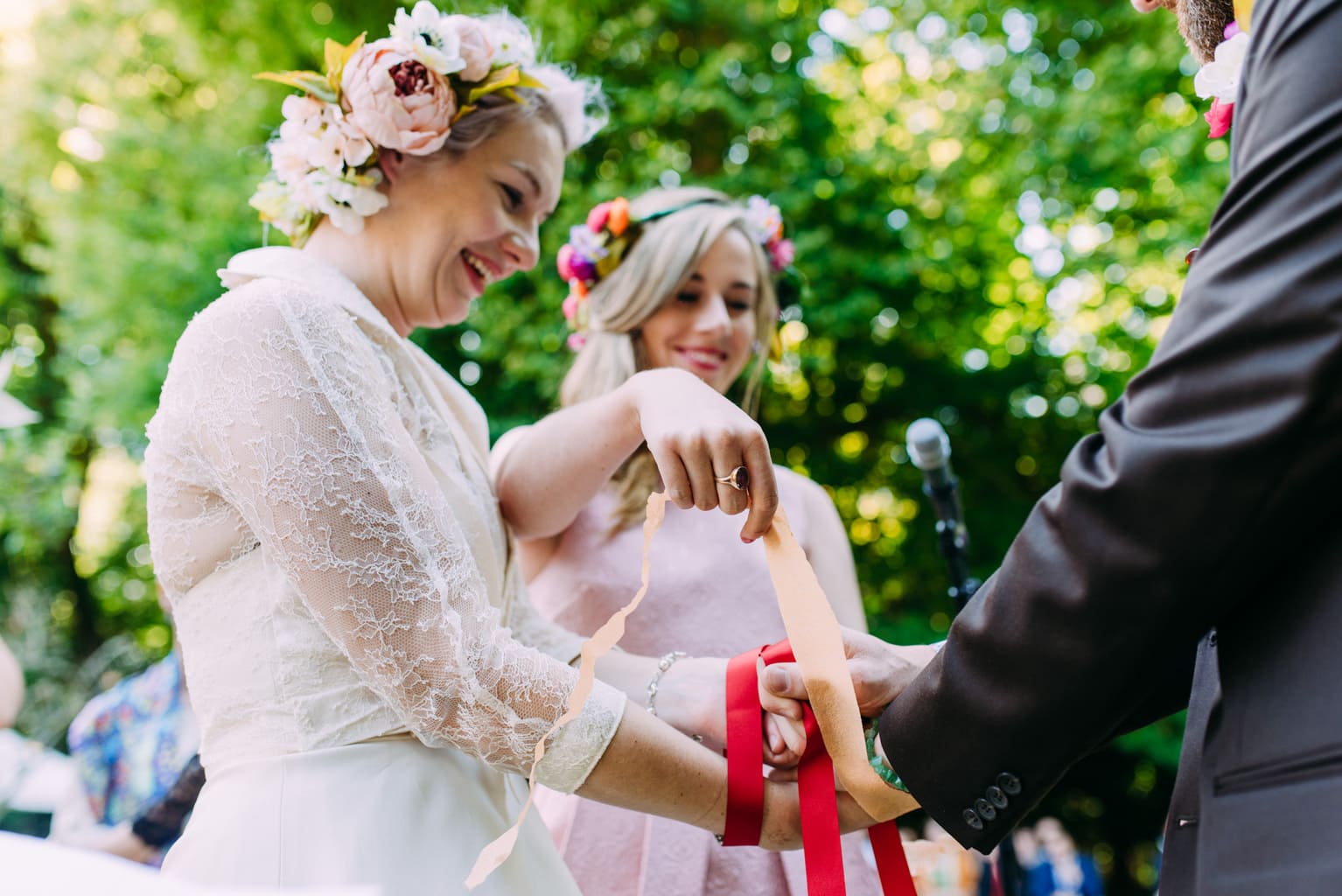 © Anna Pumer Photography wedding ceremony handfasting in an orchard