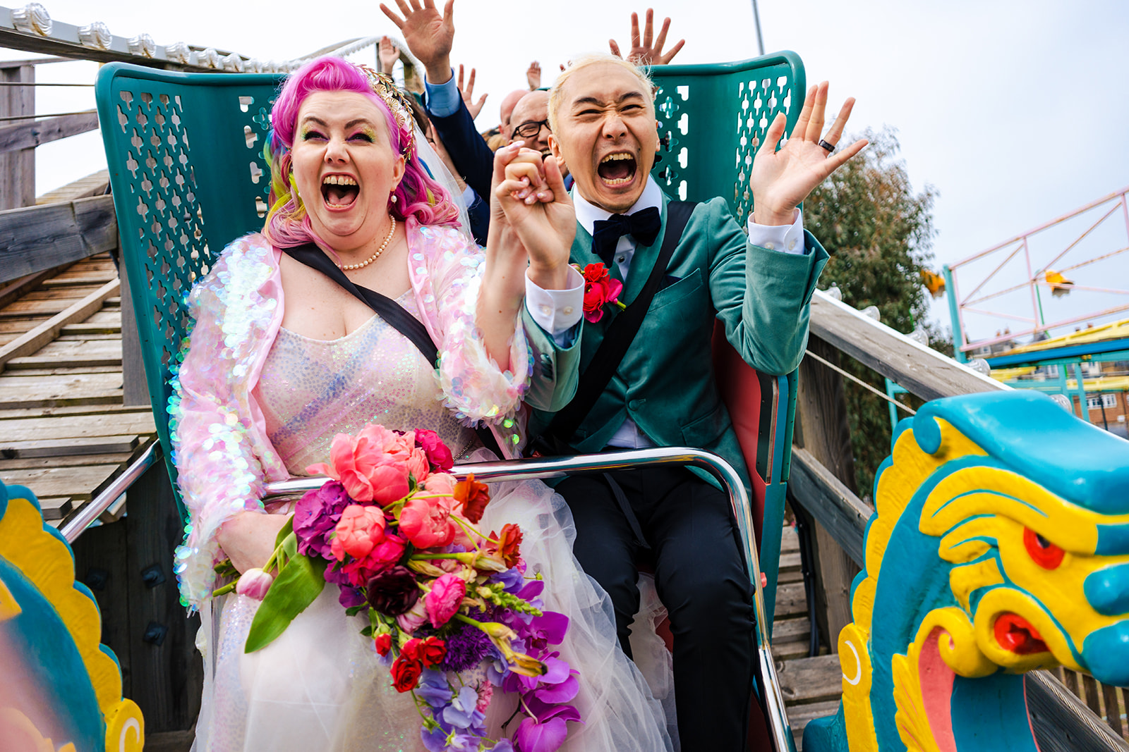 Bride with a bright bouquet cheering at Dreamland Margate