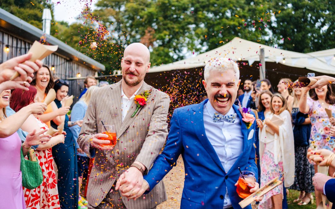 Colourful stormy Hawthbush Farm Sussex wedding