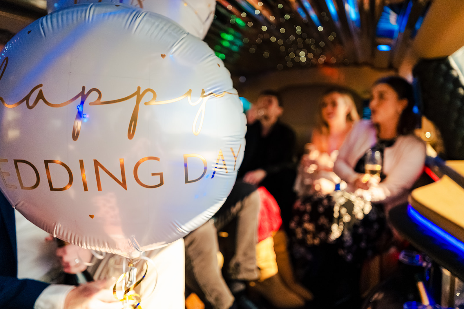 Wedding day balloon in the limo