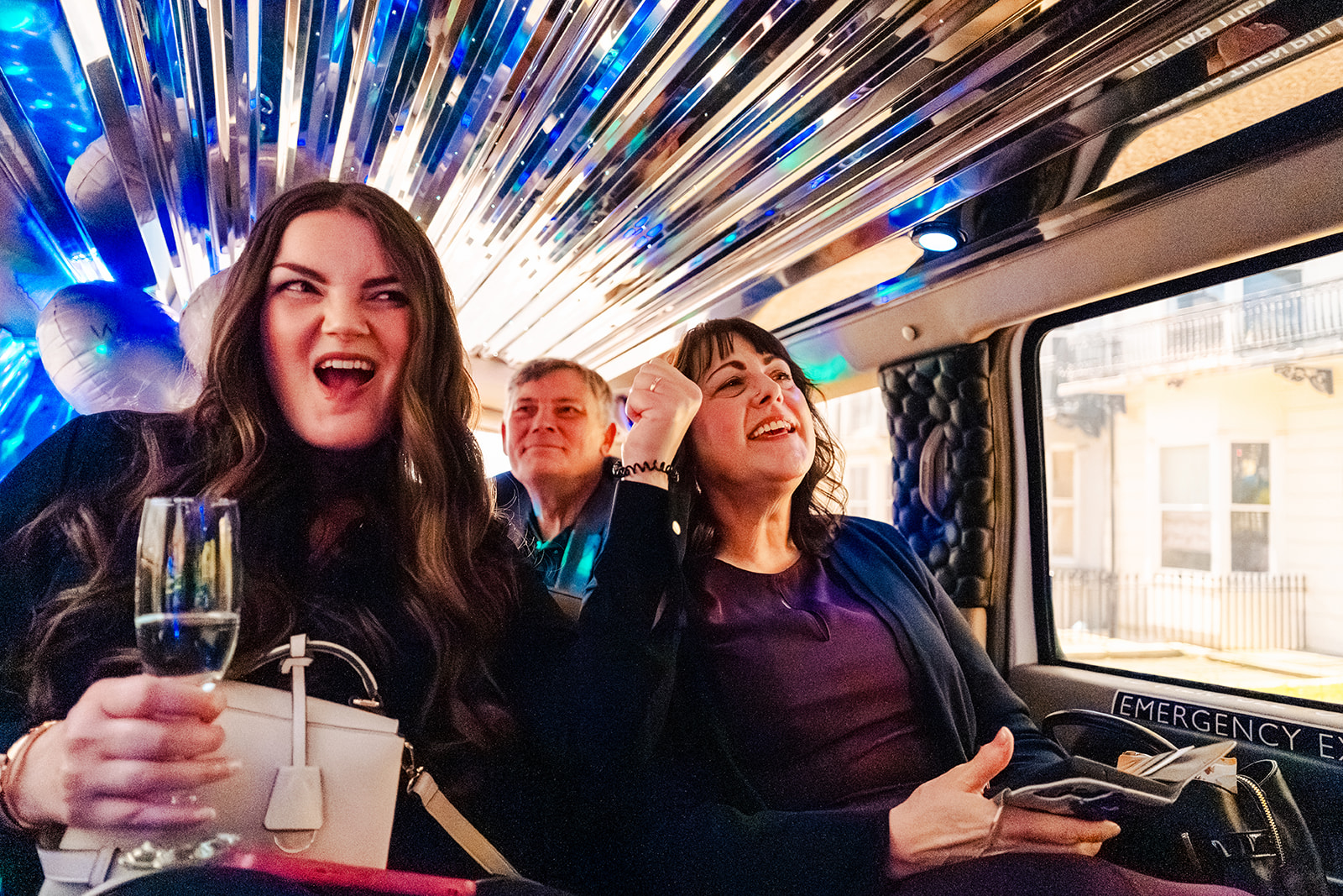 Guests celebrating in the party limo