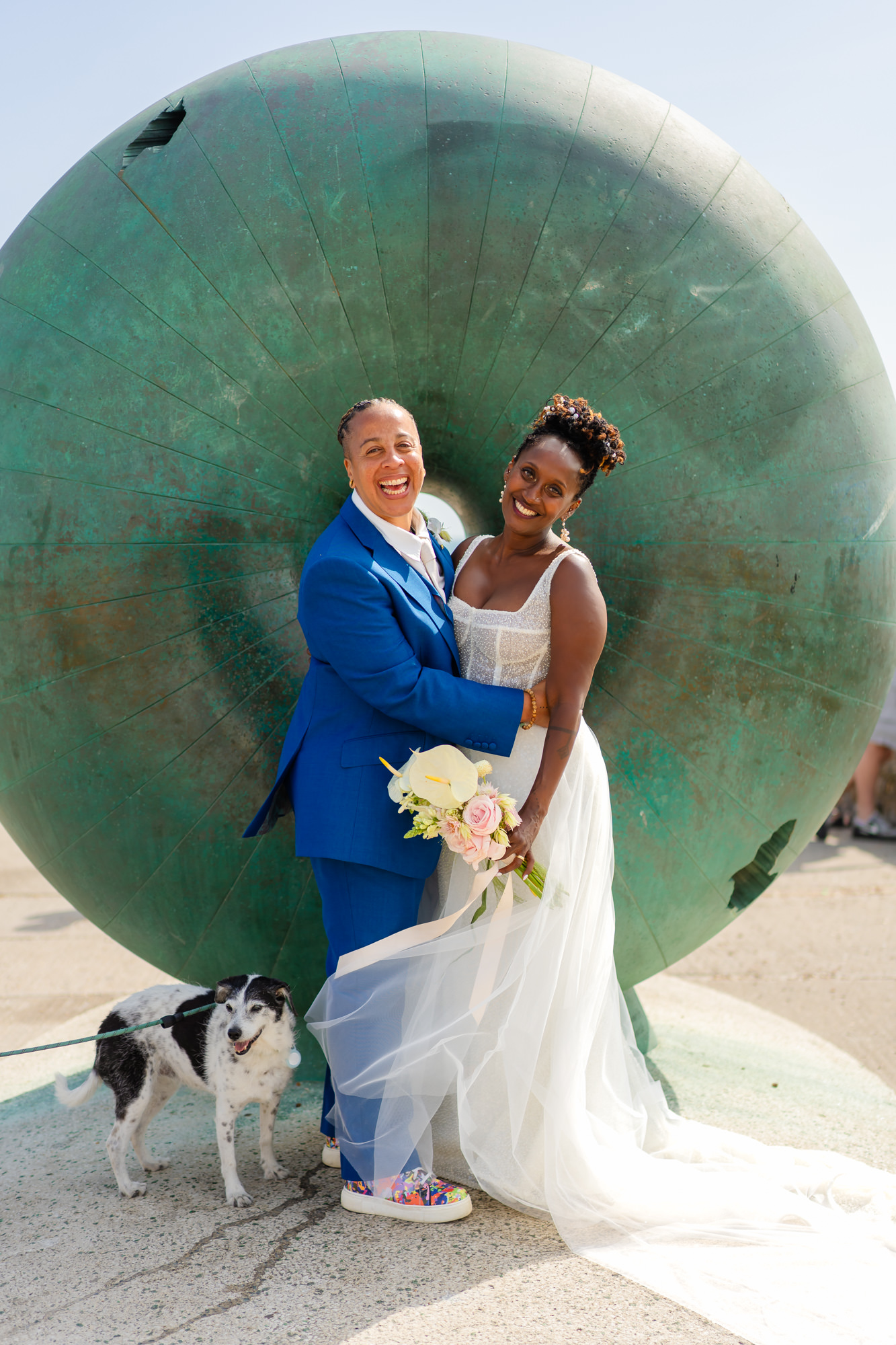 Couple portrait by the sculpture on Brighton seafront