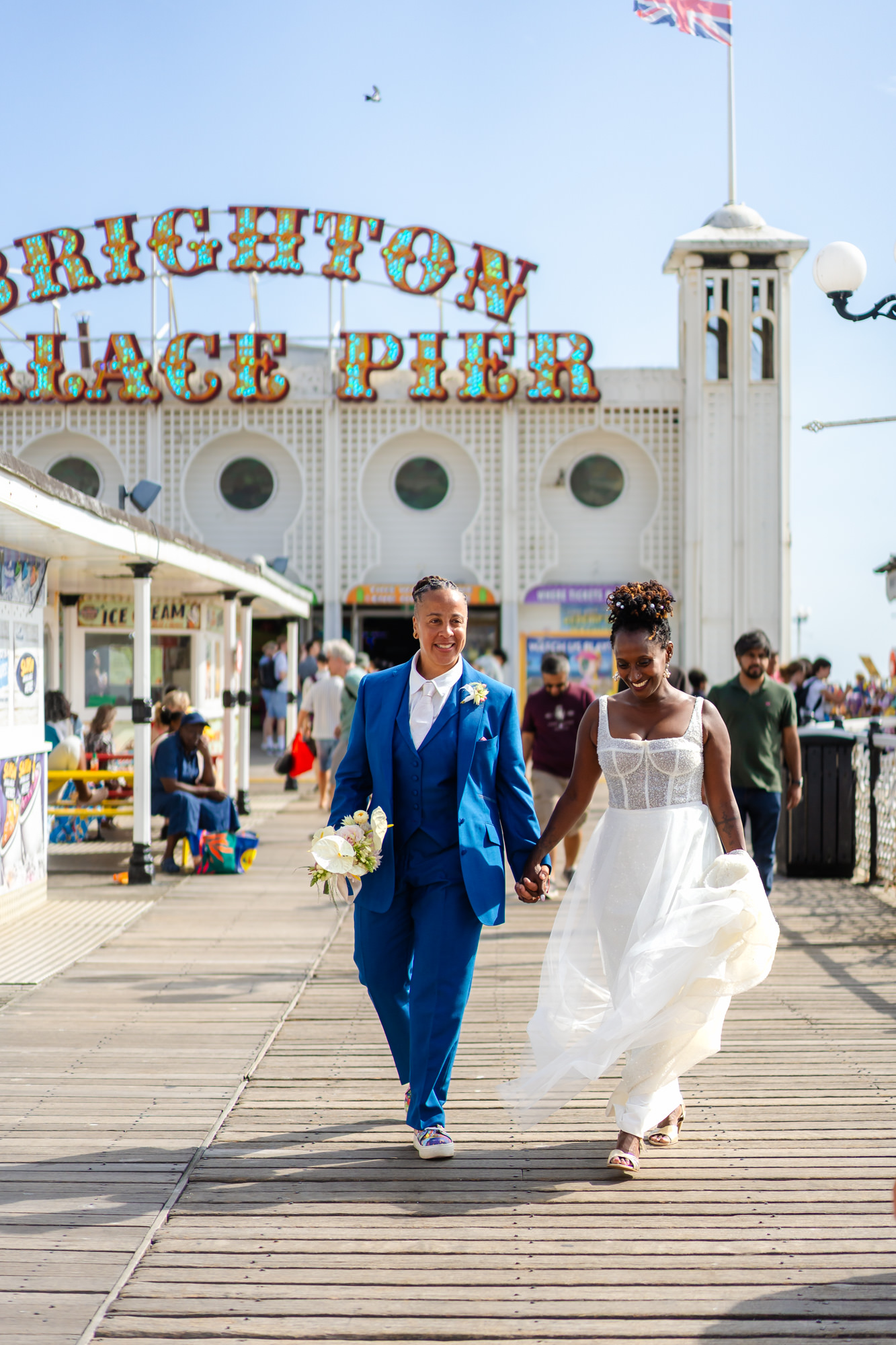 Walking along the seafront by the Palace Pier