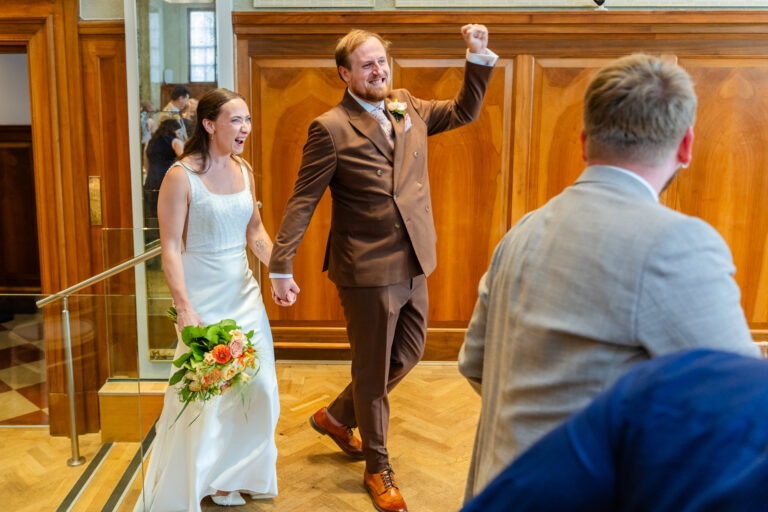 Bride and groom celebrating at Pelham House, Lewes