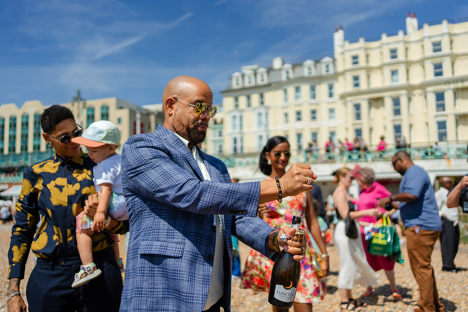 Guests popping drinks on Brighton beach