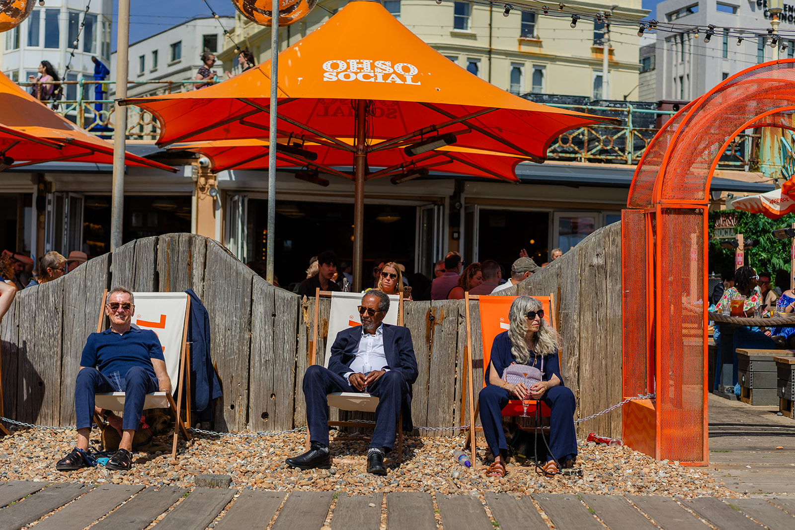 Brighton beach bar with orange umbrellas