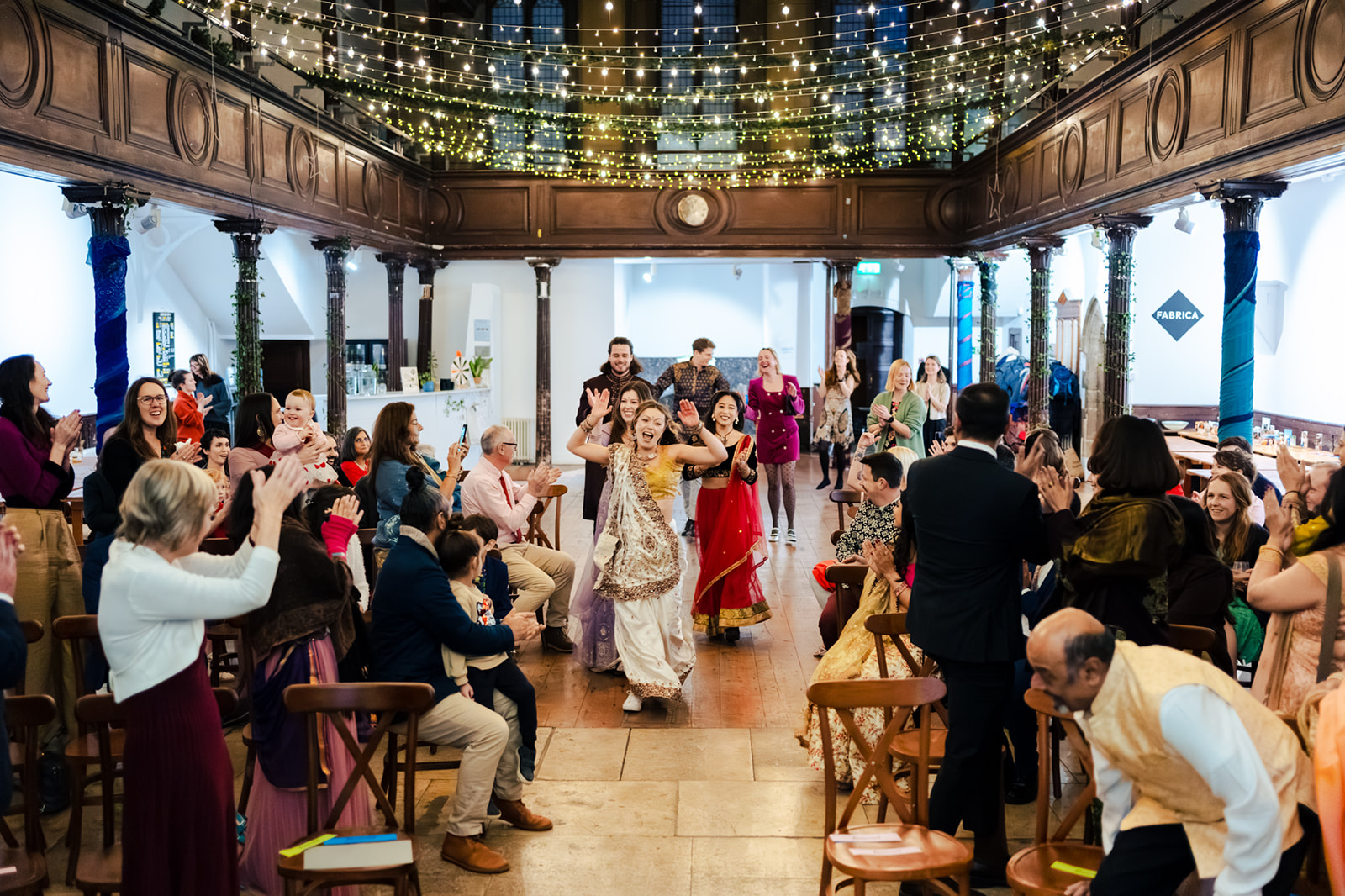 Cat dancing up the aisle at Fabrica as guests cheer