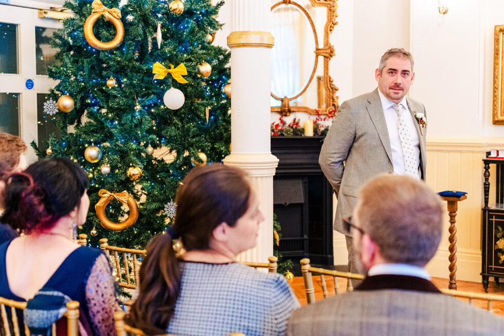 Rosie and Ross's winter ceremony by the Christmas tree