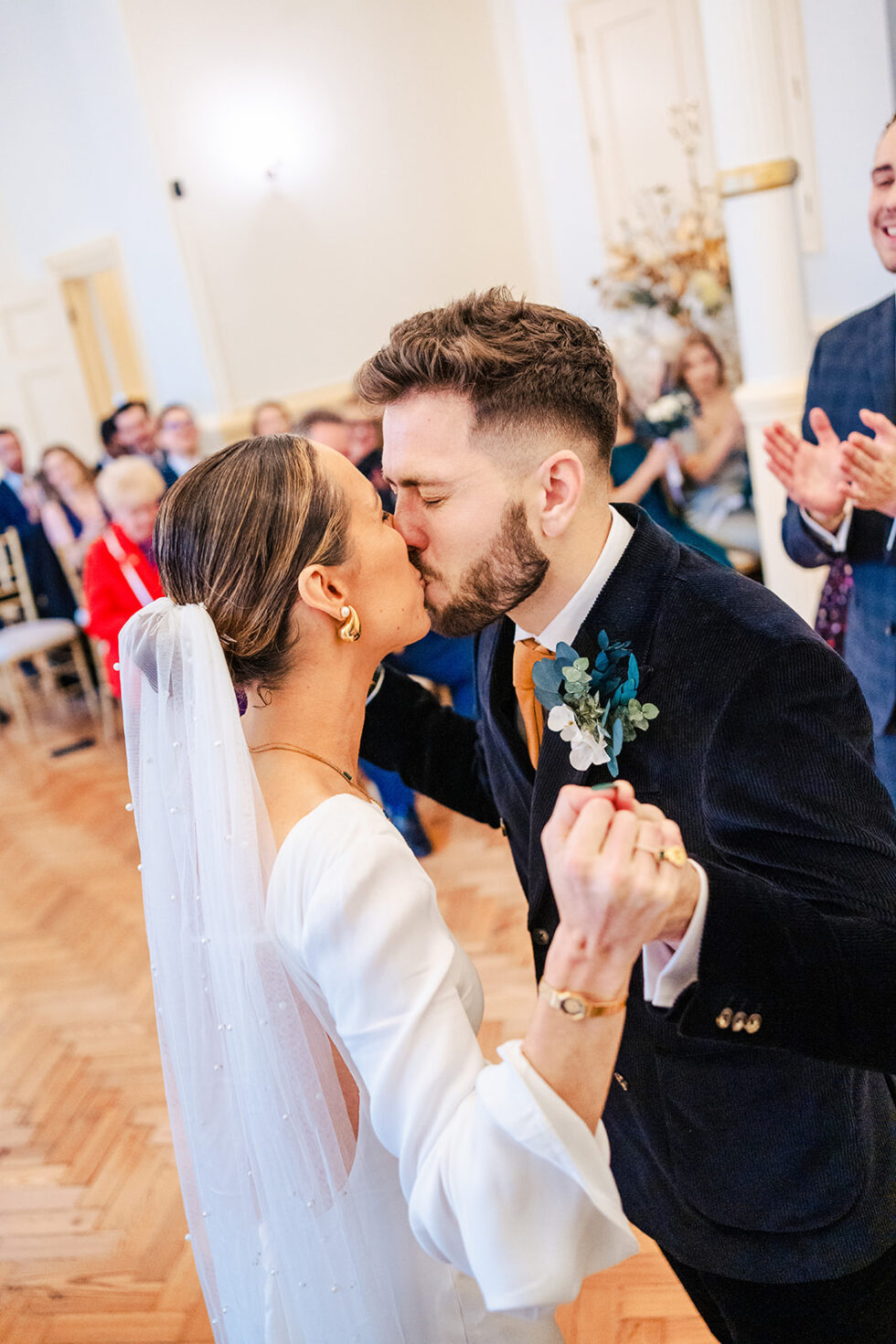 Sophie and Ed kissing at their winter wedding
