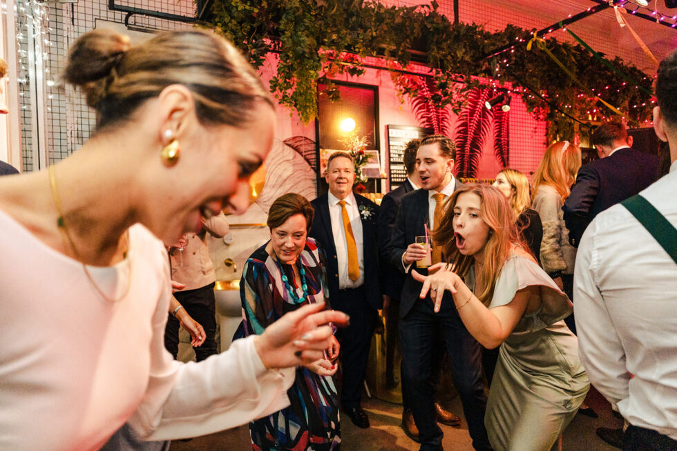 Laughing guests at Sophie and Ed's Red Roaster wedding