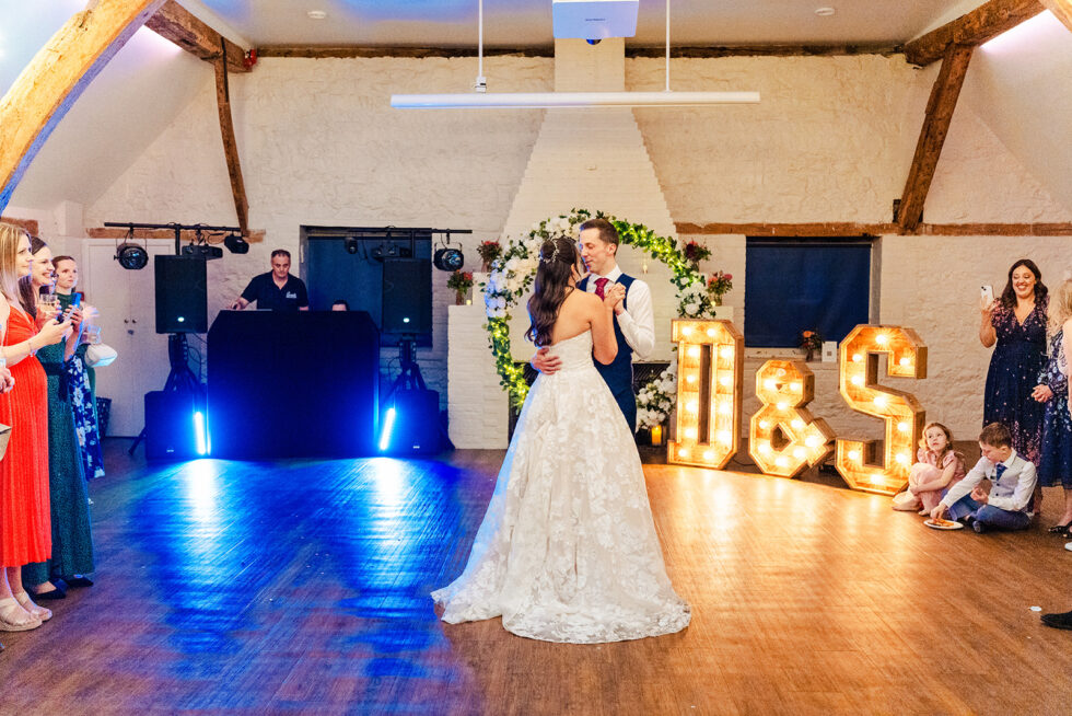 Steph and David's first dance under blue lights