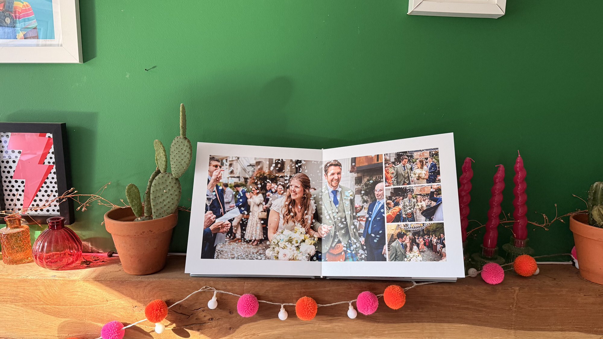 10x10 layflat wedding album open on a mantelpiece